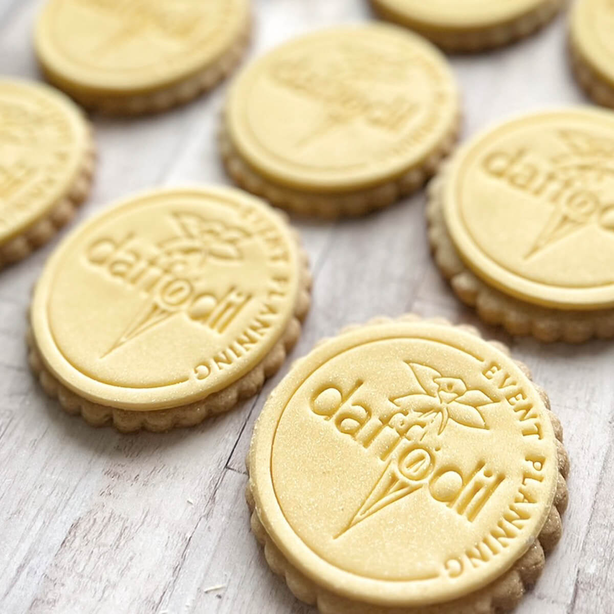 Cookies with 'Daffodil' branding on a wooden surface
