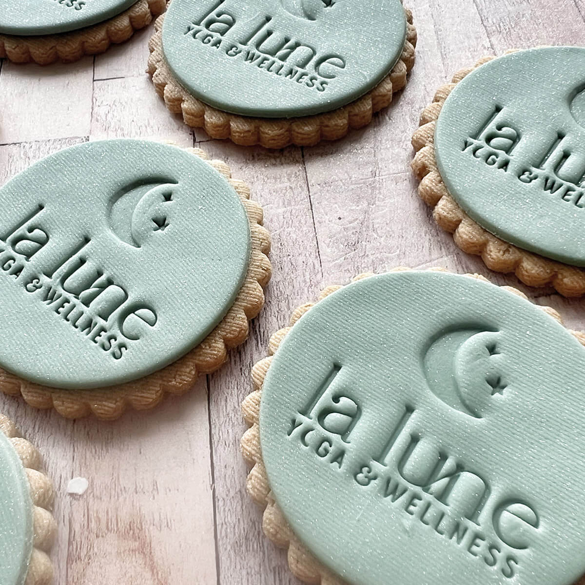 Yoga blocks with 'La Lune Yoga & Wellness' branding on a wooden surface