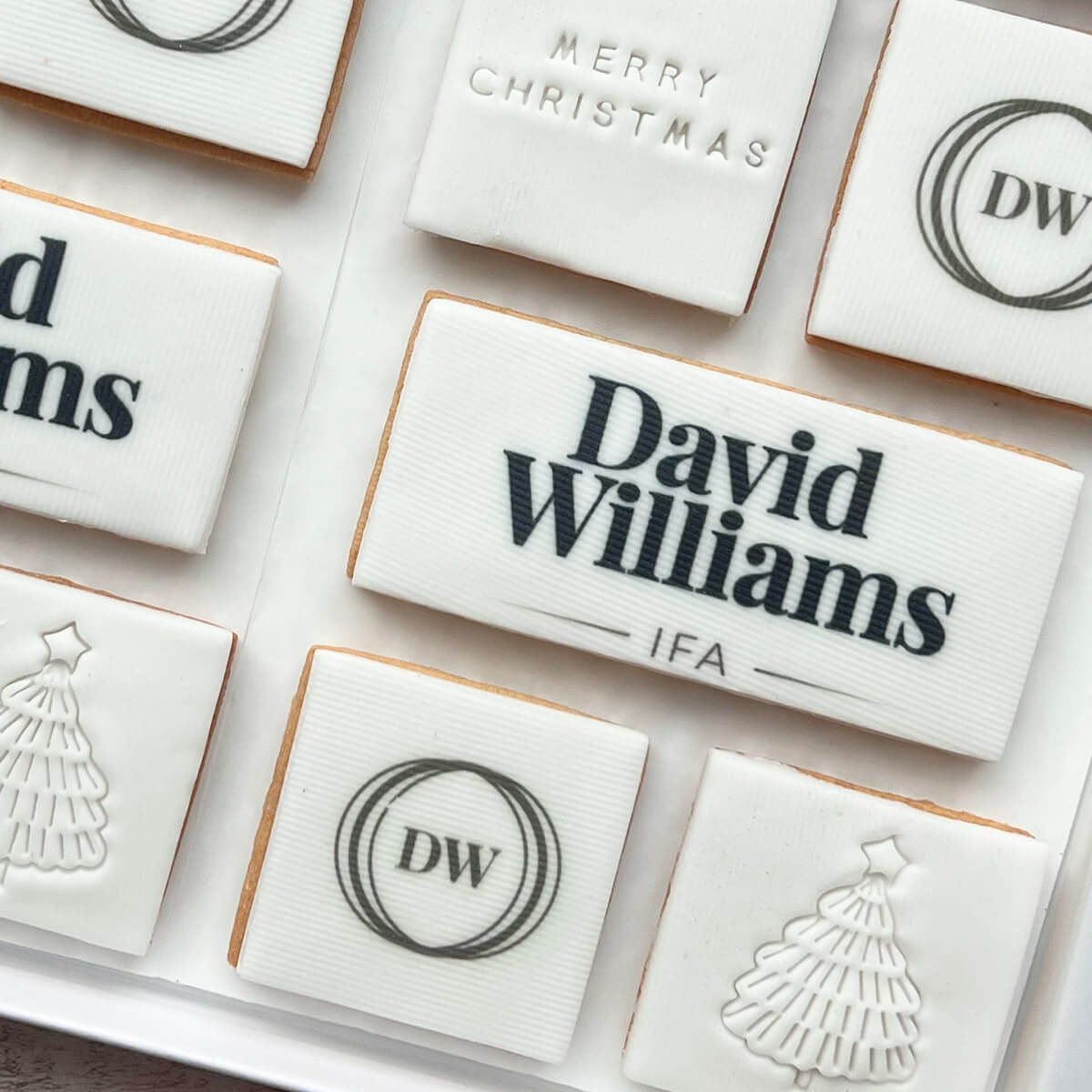 Decorative cookies with 'David Williams IFA' branding and Christmas-themed designs.