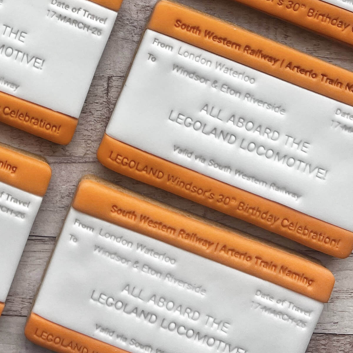 Tickets for South Western Railway's Legoland locomotive celebration on a wooden surface